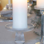 Glass candle holder with wide base