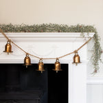 A stunning garland featuring 5 brass bells hung on a rustic style rope complete with hooks either end.