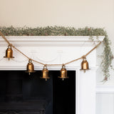 A stunning garland featuring 5 brass bells hung on a rustic style rope complete with hooks either end.