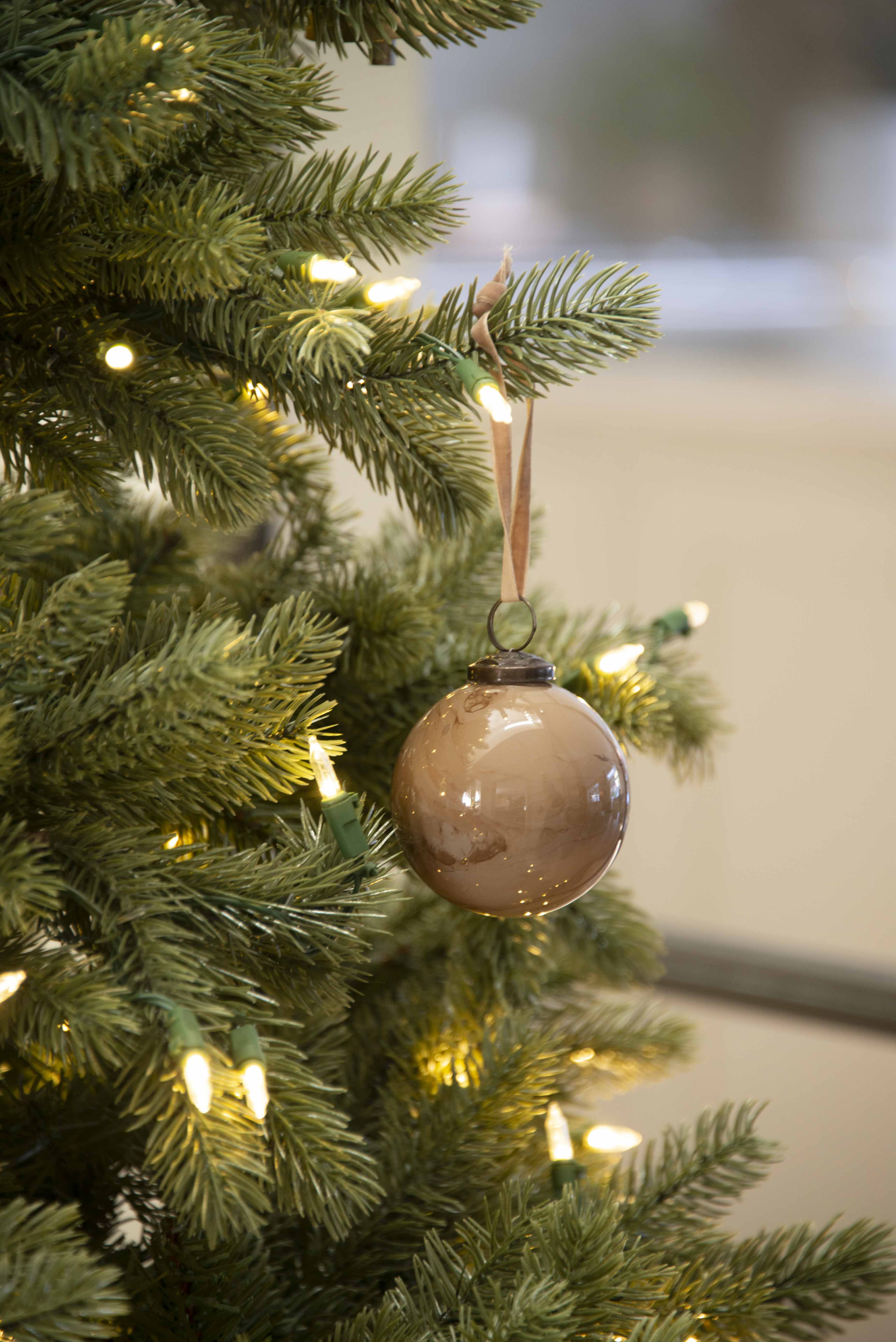 Each bauble is hand-blown, resulting in a one-of-a-kind mottled effect that highlights the natural beauty of the material.