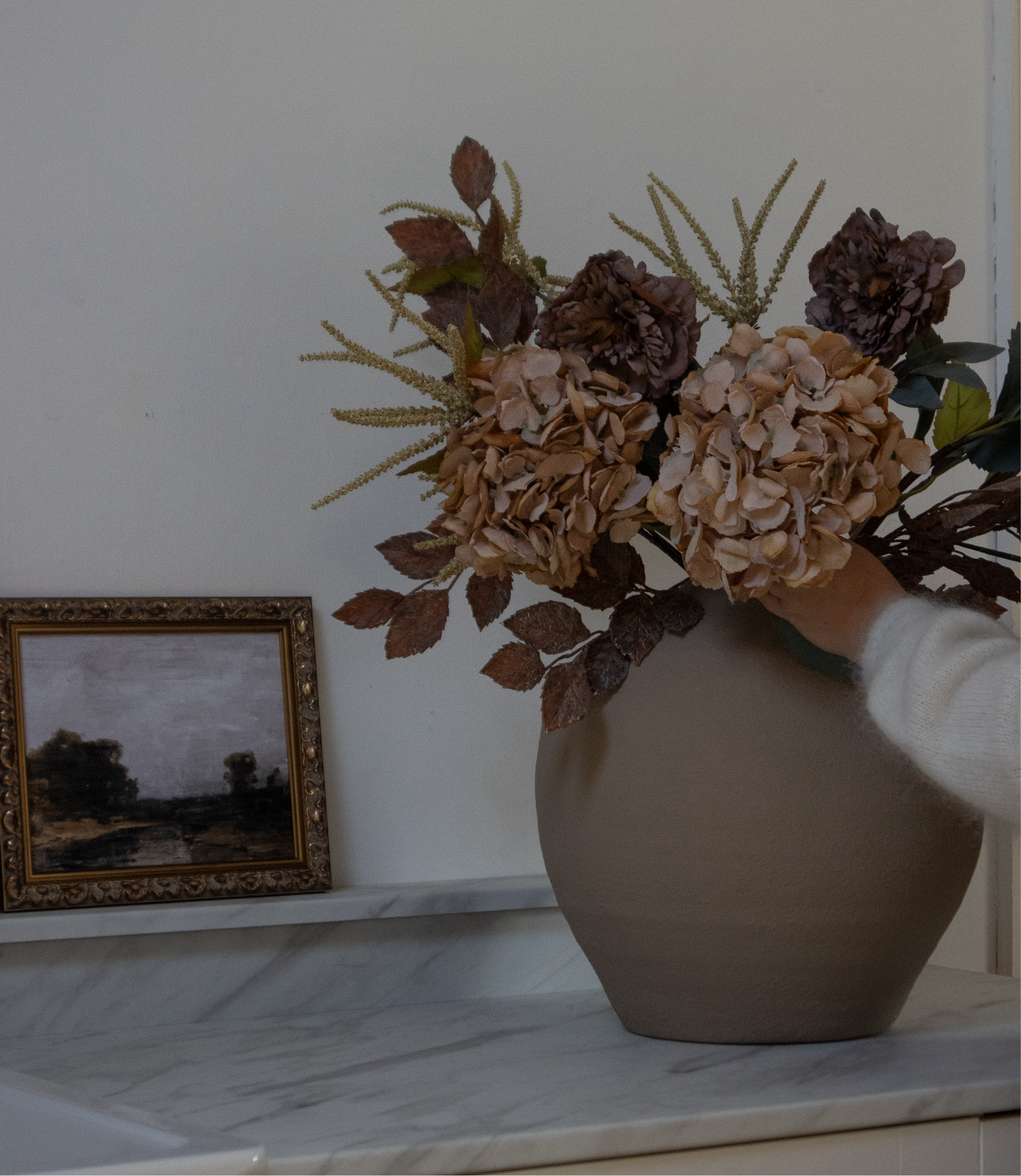 Brown Amaranthus in a round terracotta vase