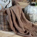 brown quilted throw