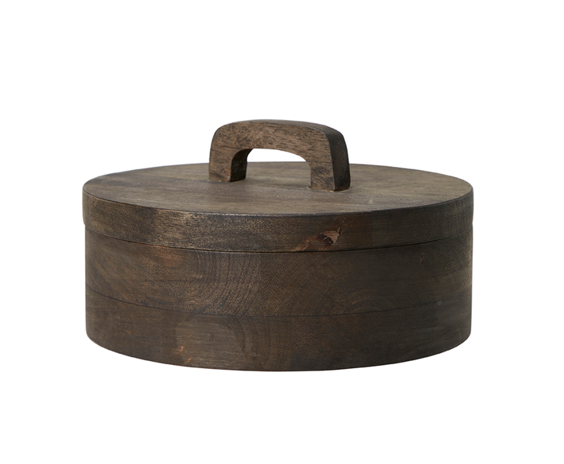 A striking wooden pot with lid in dark wood.