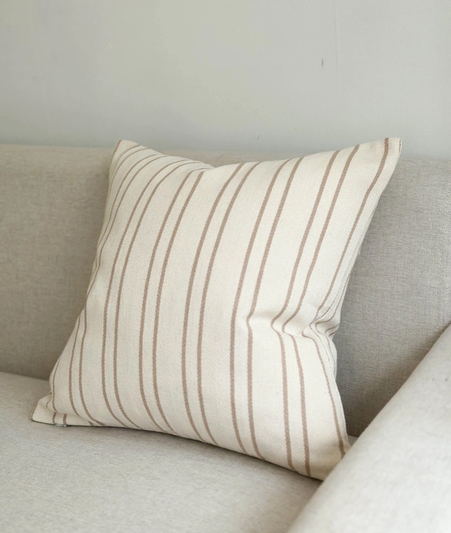 The Luxury Beige Stripe Cushion, crafted from premium cotton, exudes a rustic elegance that adds a touch of luxury to any space.