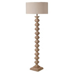 A stunning floor lamp in a beautiful turned fir wood complete with off white linen shade.